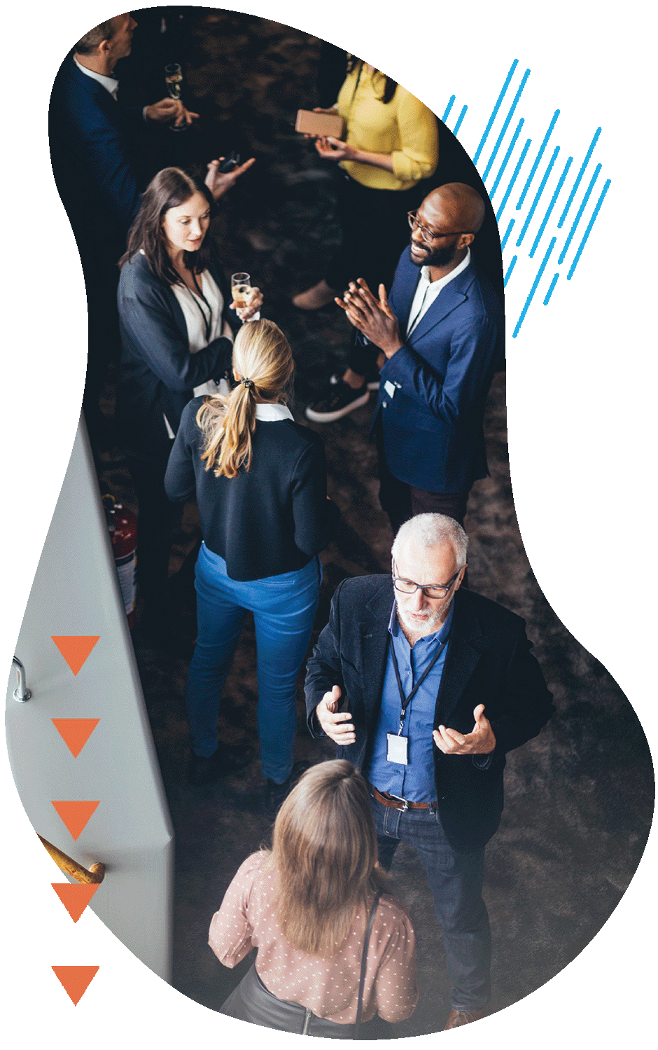 A group of business conference participants discussing a presentation in the hotel foyer together.